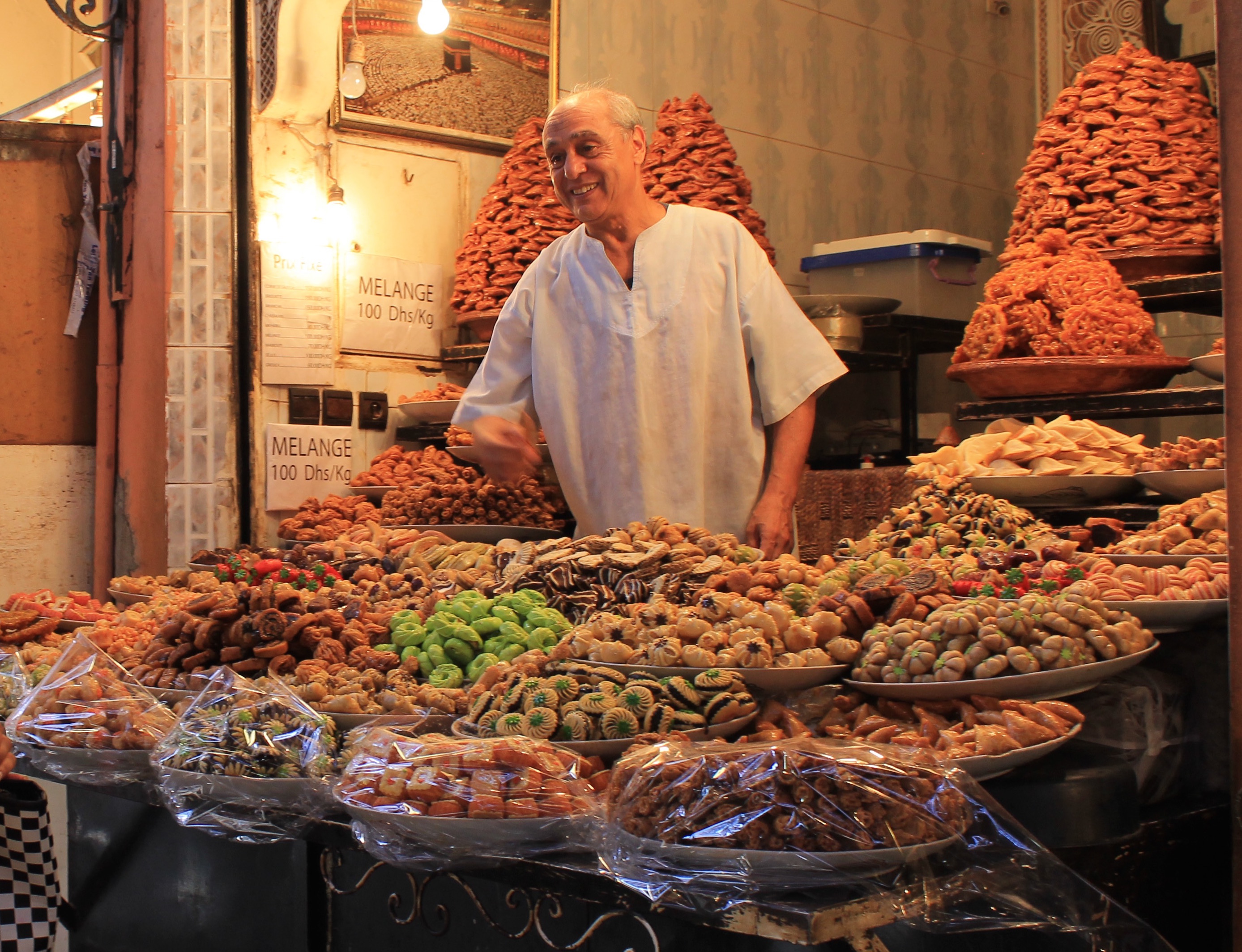 Argan Sports tasting tour man selling sweets in the souk